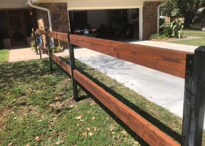 Red Cedar Tone Stained Rail Fence With Metal Posts