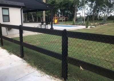 Black Stained Wood Rail & Metal Post Fence With Chain Link